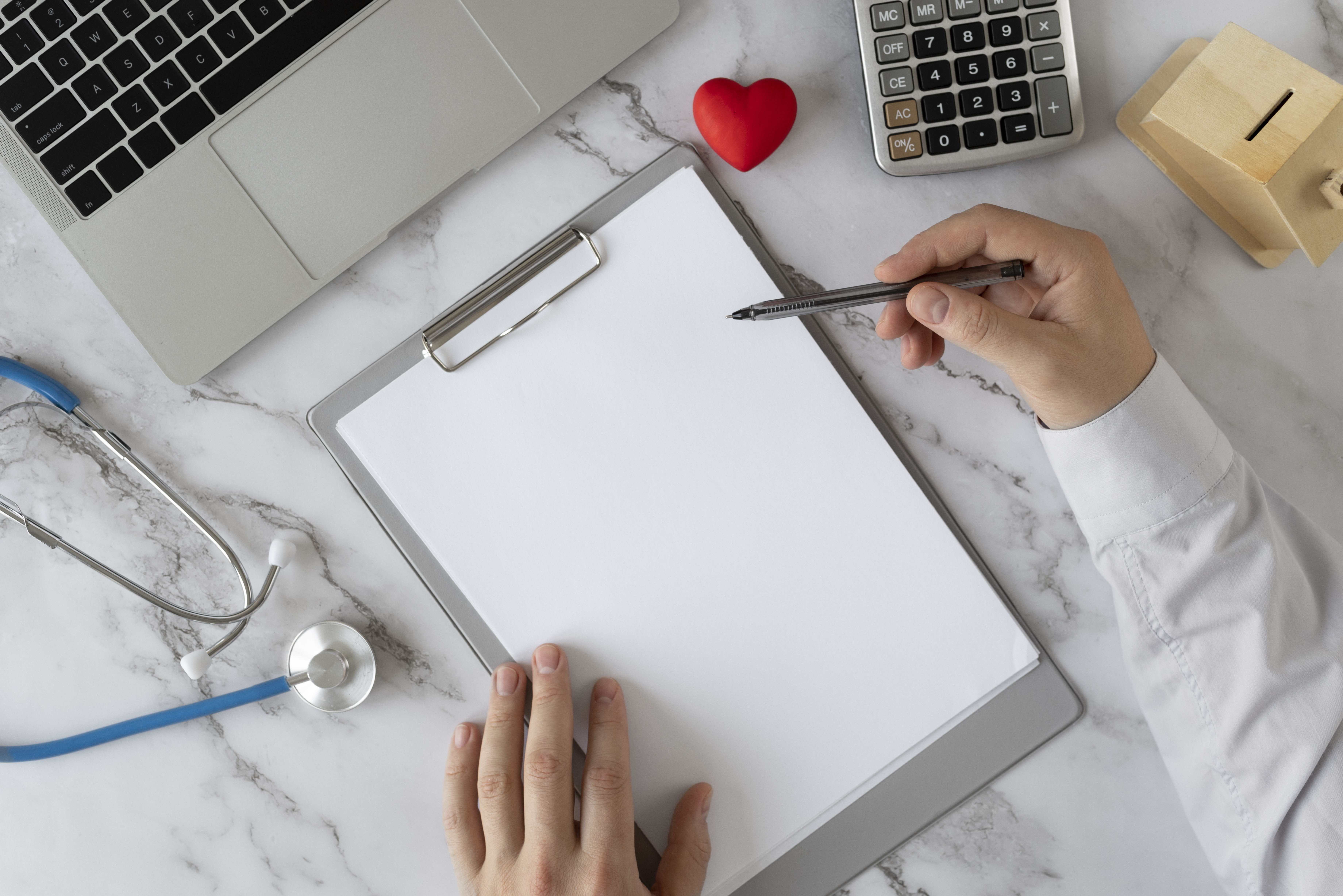 close-up-hand-holding-pen-top-view